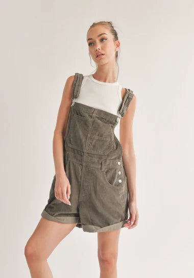 Model wearing olive green dungarees from Sophie May Boutique, perfect for casual holiday outings.
