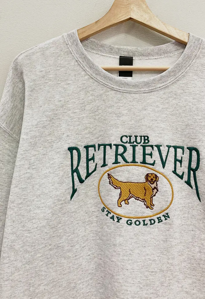 Club Retriever embroidered sweatshirt in grey with oversized fit, featuring ‘Stay Golden’ design from Sophie May Boutique.