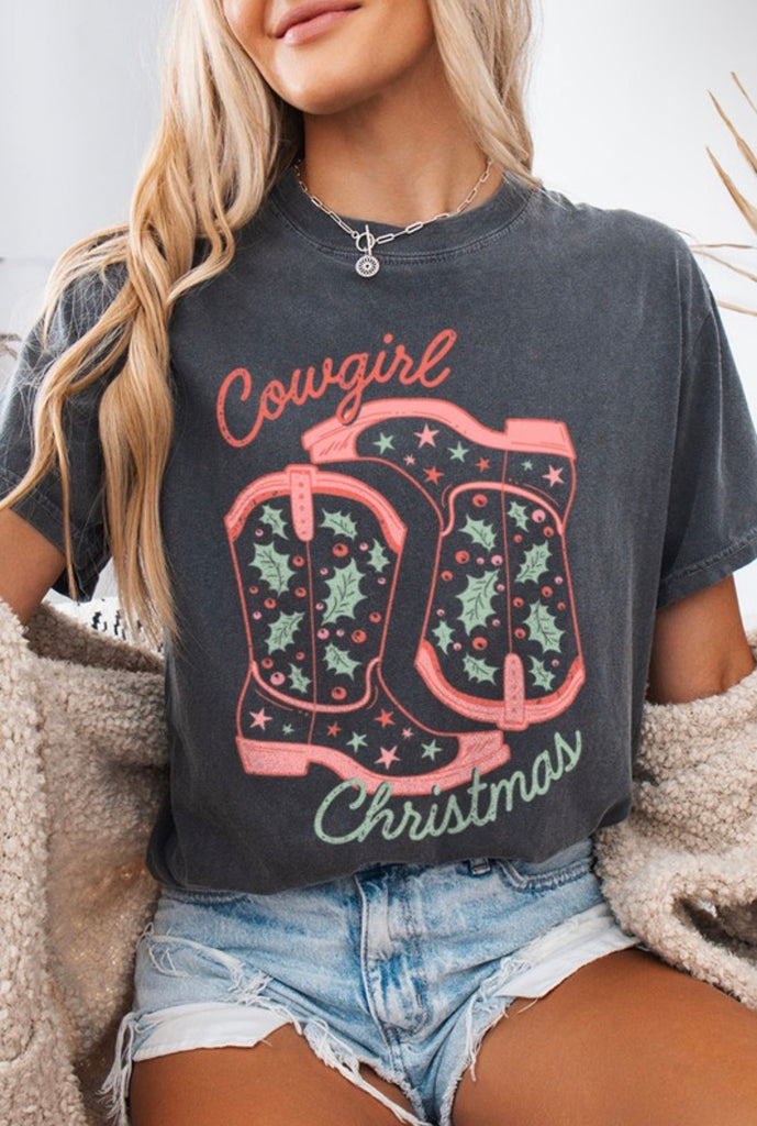 Cowgirl Christmas Boots Tee featuring graphic cowboy boots, perfect for women’s clothing from an online women’s boutique.