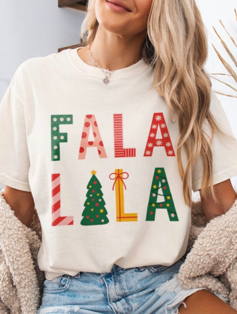 Fa La La Holiday Tee for women, featuring retro lettering and Christmas tree icon, perfect for cozy December outings.