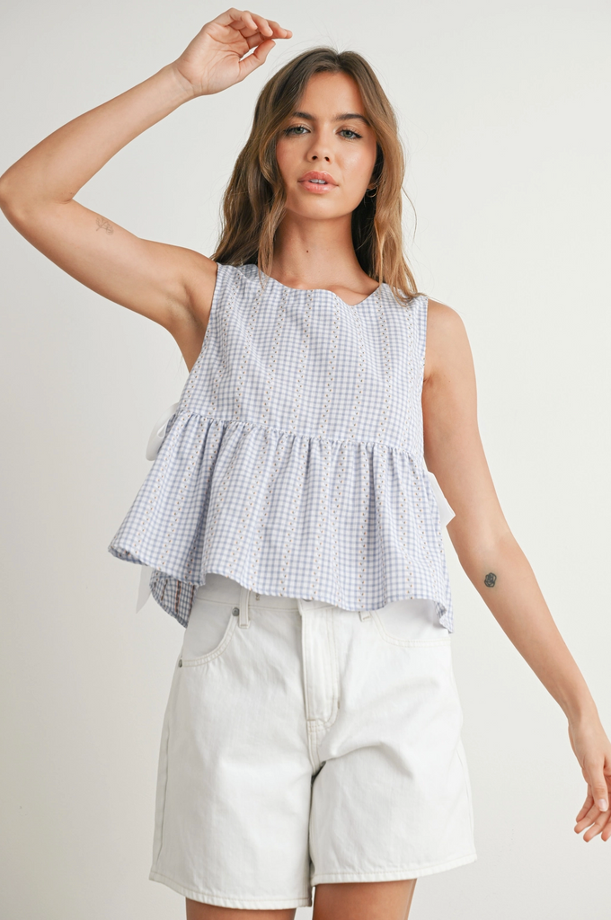Sky Meadow Peplum Top from Sophie May Boutique features blue gingham print, perfect for summer outfits.
