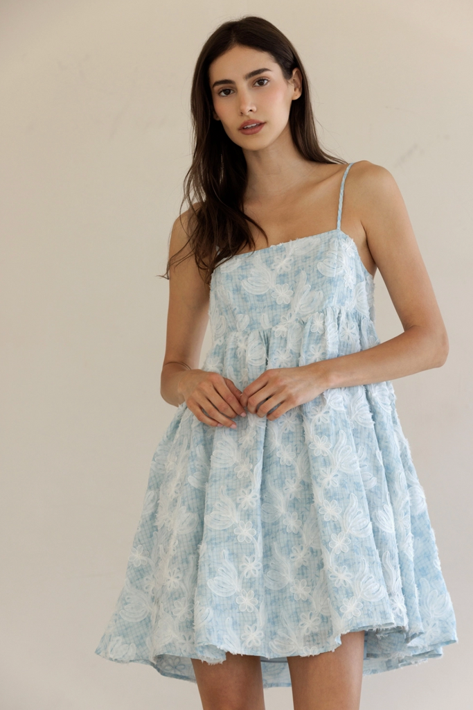 Textured floral print mini dress from Sophie May Boutique, perfect for summer, featuring a sweetheart neckline and adjustable straps.