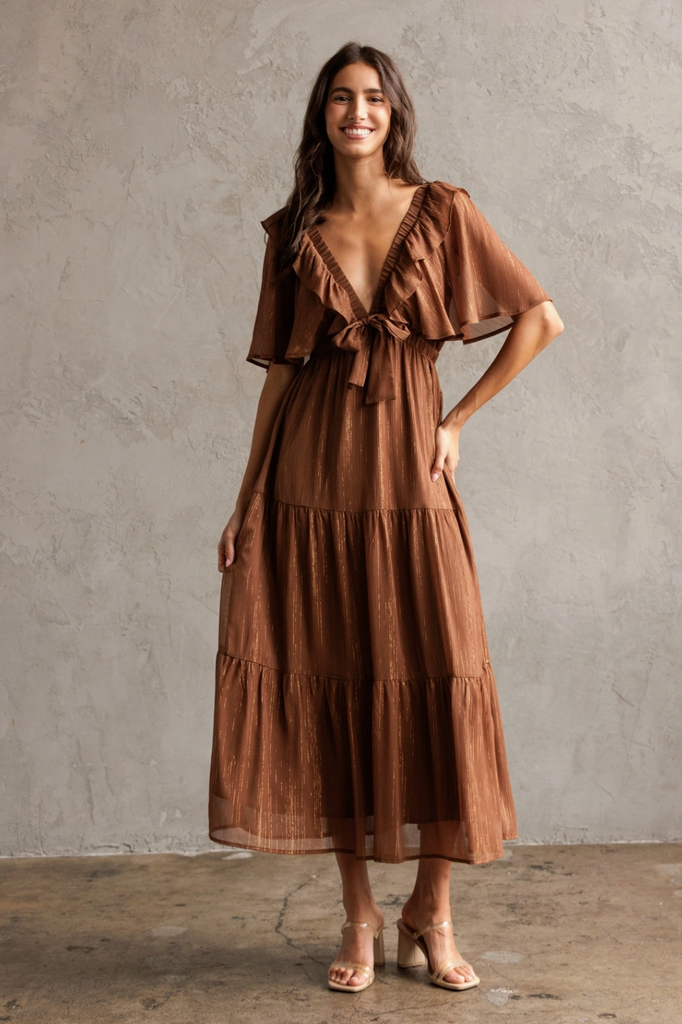 Sophie May Boutique Simmer Metallic Tiered Midi Dress, flirty A-line silhouette with ruffle trim and sheer sleeves.