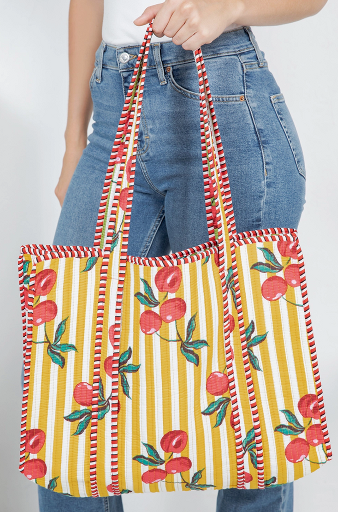 Quilted Tote Bag with cherries and striped design, perfect for summer outfits. Available at Sophie May Boutique.