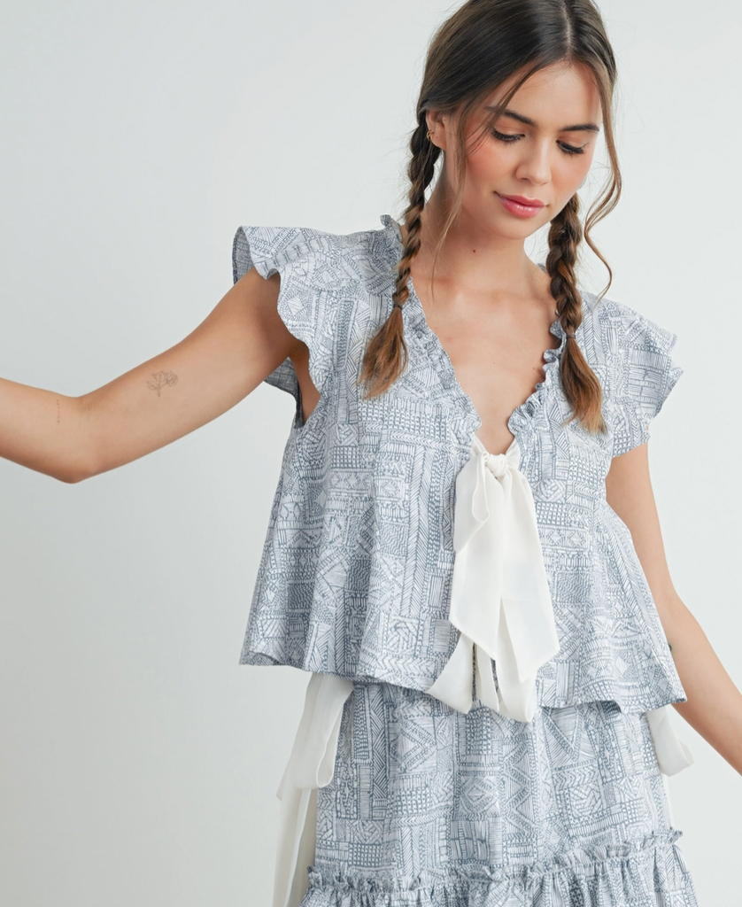 Boho ruffle tie-front top from Sophie May Boutique, perfect for summer outings in soft hues and geometric print.